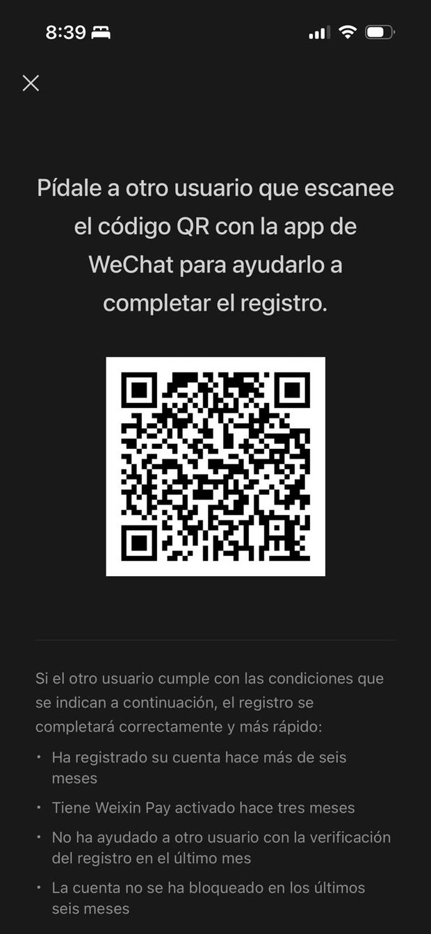 Pantalla de WeChat pidiendo que otro usuario escanee el código QR para completar el registro
